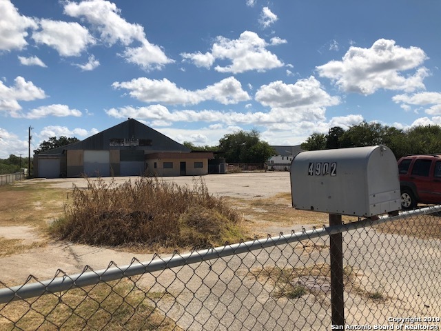 Opportunity for investment/development on approximately 6 acres improved property with frontage on high-traffic, high-growth South San Antonio corridor.  Fenced yard with 16,000 SF Metal high-ceiling building with concrete loading dock, 220 single phase, 8-14' doors, 2" water main, and more.  Includes residential mobile home, outbuildings, and secure, perimeter fencing.  Unique property for user/developer.  Mixed-use, investment, storage.  Zoned I-1 with C-3 frontage and MC-1 overlay.  This property has great potential for various uses.  Invest now in developing corridor of South SA near Loop 410. Call Agent for showing.