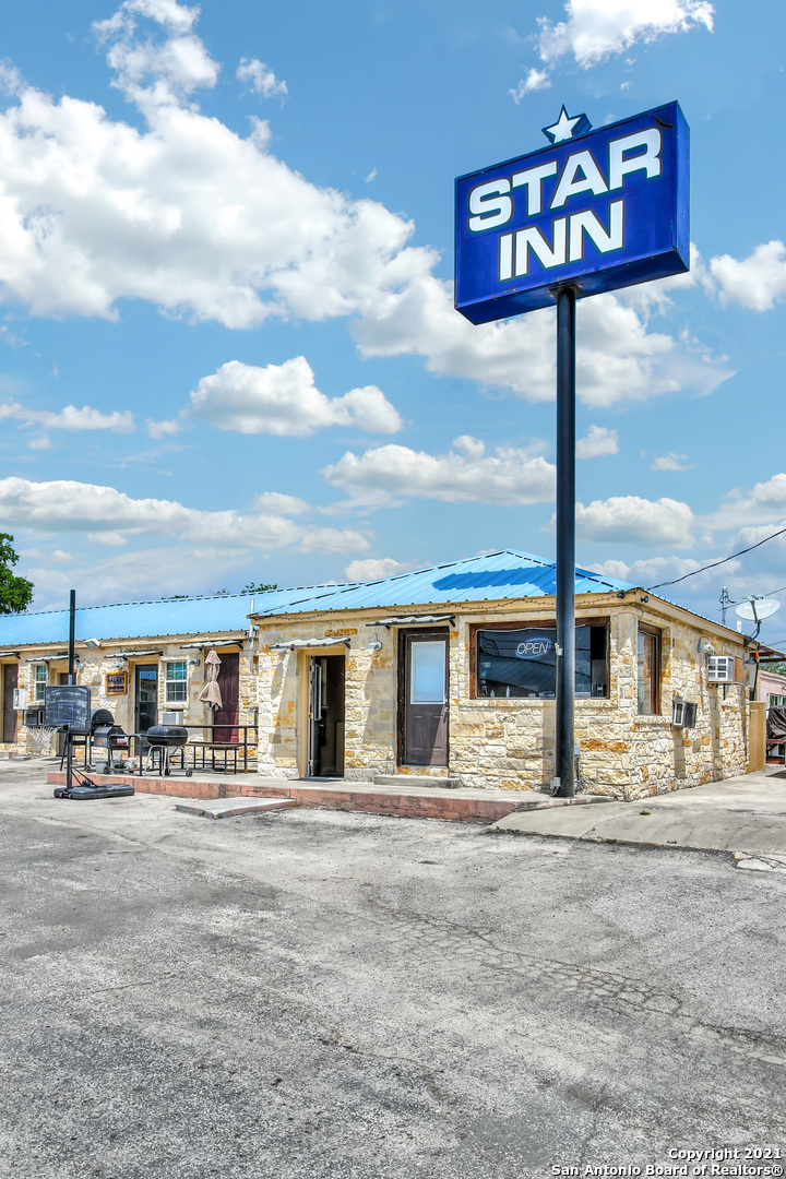 AMAZING investment opportunity in the heart of the Eagle Ford Shale! Motivated seller! IMMACULATELY maintained Star Inn & Suites! Hotel offers 16 rooms to rent, (5-suites, 9-singles, and 2 budget doubles), office, manager suite and commercial size utility room! Property is located in the center of Karnes City! Paved parking accommodates approx. 18 parking spaces for guest! The Star Inn & Suites has a long history in the city of Karnes and maintains a great reputation! This one story, 16 room hotel presents the new investor the opportunity to purchase a well maintained turnkey asset that will require minimal renovations with low-cost operations! Don't hesitate on this great opportunity!