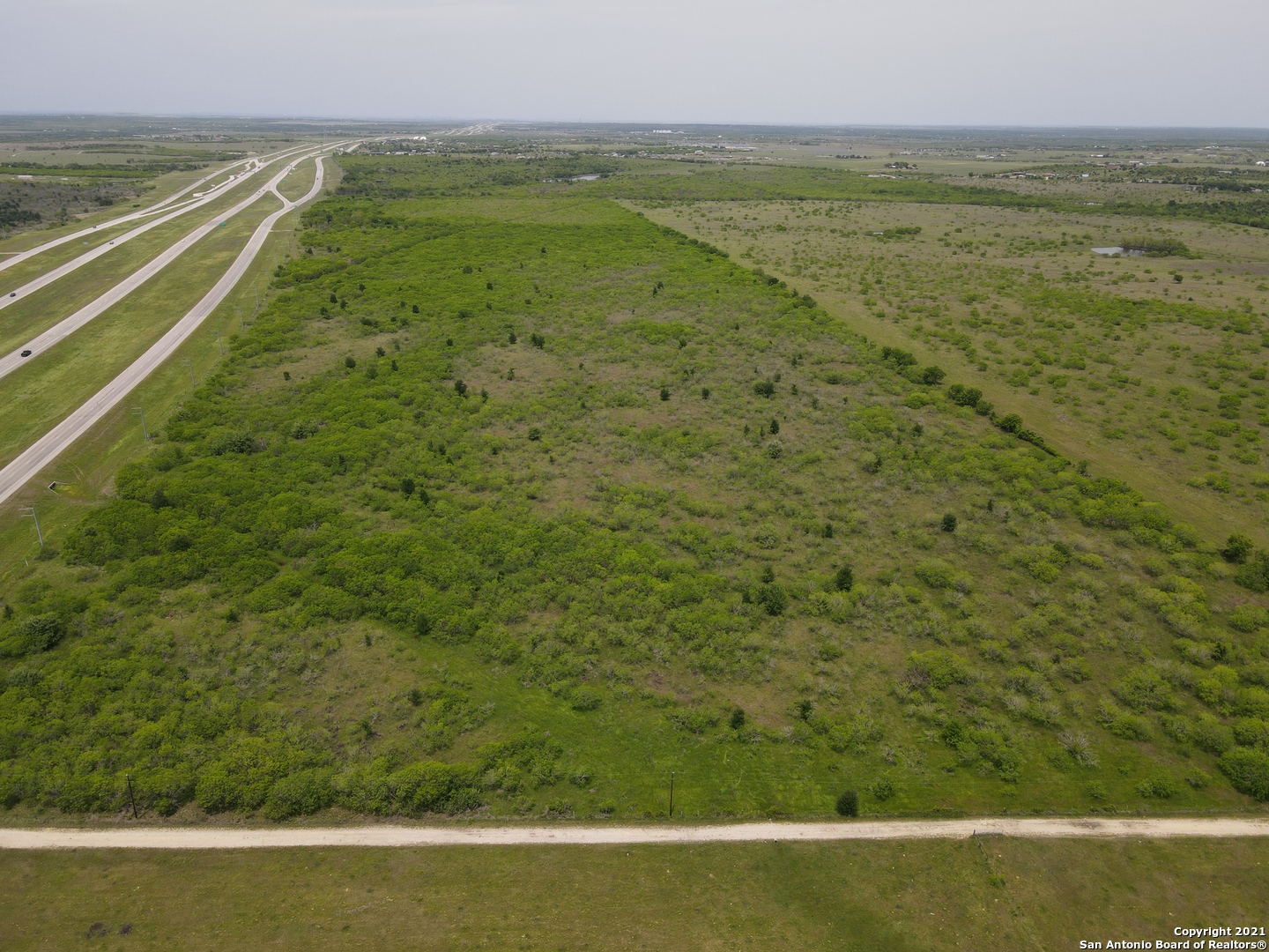 91 +/- Acres of flat, usable land with approximately 3900 feet of frontage on Hwy 183/SH-130. Less than 20 minute drive to Austin Bergstrom International Airport. Perfect for warehousing, shipping, storefront, etc. Call Will Clark directly at 512-557-2984 for inquiry.