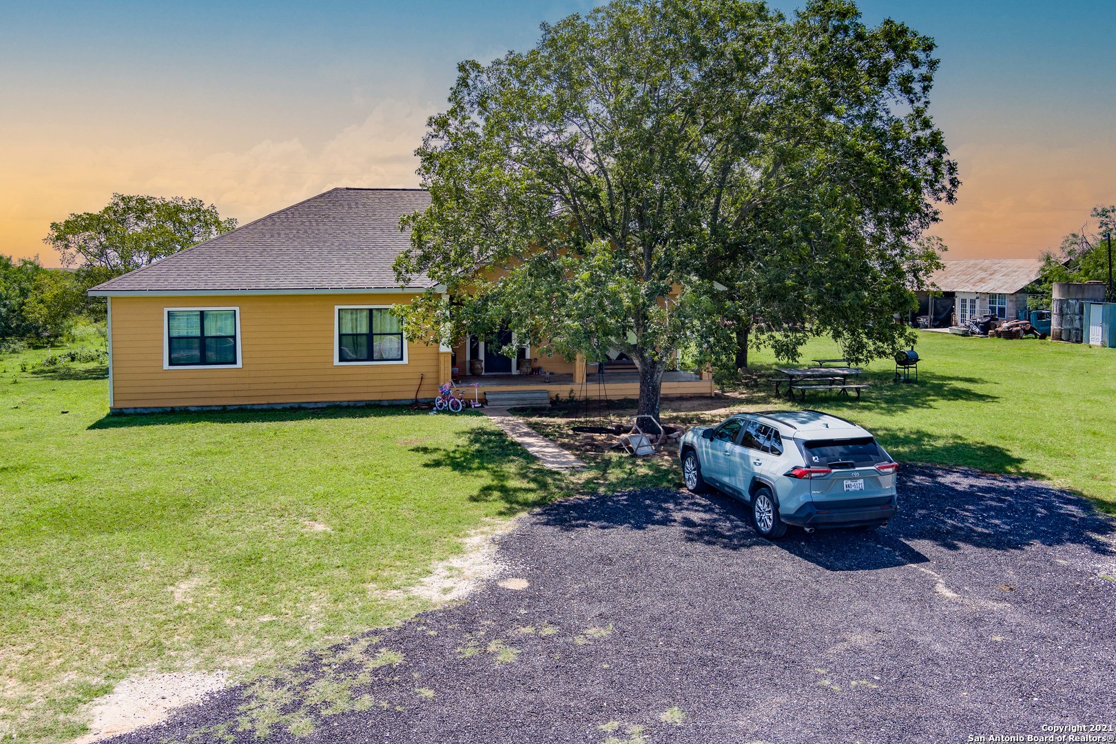 Beautiful home on 20 acres, minutes from the middle of San Antonio so you have the advantage of running your business at your home. Always a breeze, no flood zone, out buildings include 1 area for a man cave or working on your favorite vehicle, covered work area with electric and water perfect for your own welding shop.