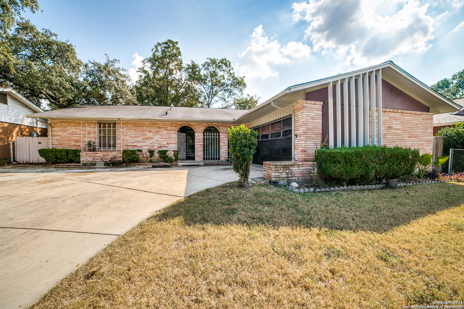 Spacious 3/2 bath 2 car garage with an attached 250 sq ft Sunroom. Centrally located, home has a large courtyard in front, open floor plan. Enjoy the large covered backyard with mature pecan trees.