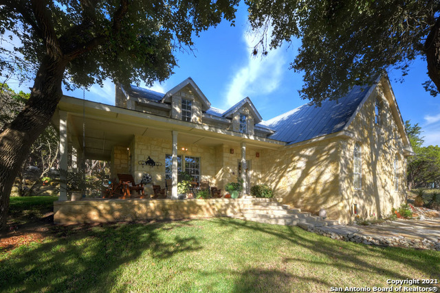 BLESS MY HEART! It is Texas Hill Country PERFECTION!! The perfect "not too big, not to small" ranchette in the highly sought after town of Boerne, TX. There are 10 acres, a GORGEOUS Hill Country custom home, a large shop, a bedroom and full bath, and a 50x60 covered pavilion/multi-use space on slab. Once you see this property, you will never want to leave. When you walk in, you will be awed with the rock fireplace that reaches to the second story ceiling. The living room is inviting and spacious. This home boasts a formal dining area as well as a breakfast nook with builtin cabinets. The kitchen looks over it all with custom cabinets, smooth cooktop, double oven and 2 access points. The master bedroom has a tray ceiling and master bath with separate vanities, a walk in shower and soaking tub. Upstairs are 3 generous bedrooms and a full bath. This home is amazing by itself, BUT there is also acreage for your animals and a topography that ensures a beautiful view.  THIS IS THE ONE!!!!