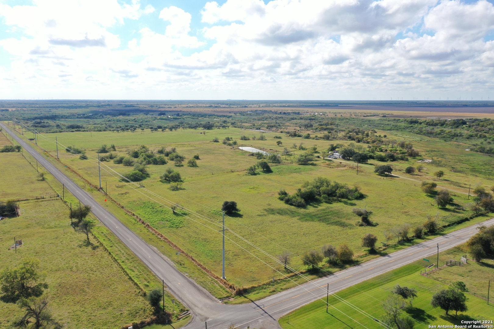 We are selling 75 acres of prime farm/ranch land in Woodsboro TX. Less than 4 miles to Woodsboro and only 10 minutes to Bayside and 40 Min to Corpus Christi. This property is currently leased for grazing and hay but the lease can be canceled with a 60 day notice. There is paved road frontage and to the right side and packed gravel road to the back. Can enter from 3 roads.  The property is fenced and cross fenced as well.     The land is estimated at 75 acres give or take. It will be surveyed once an offer is accepted. There is a total of 79.8 acres with a house. The house and 5 acres are also on the market for $295,000.00.