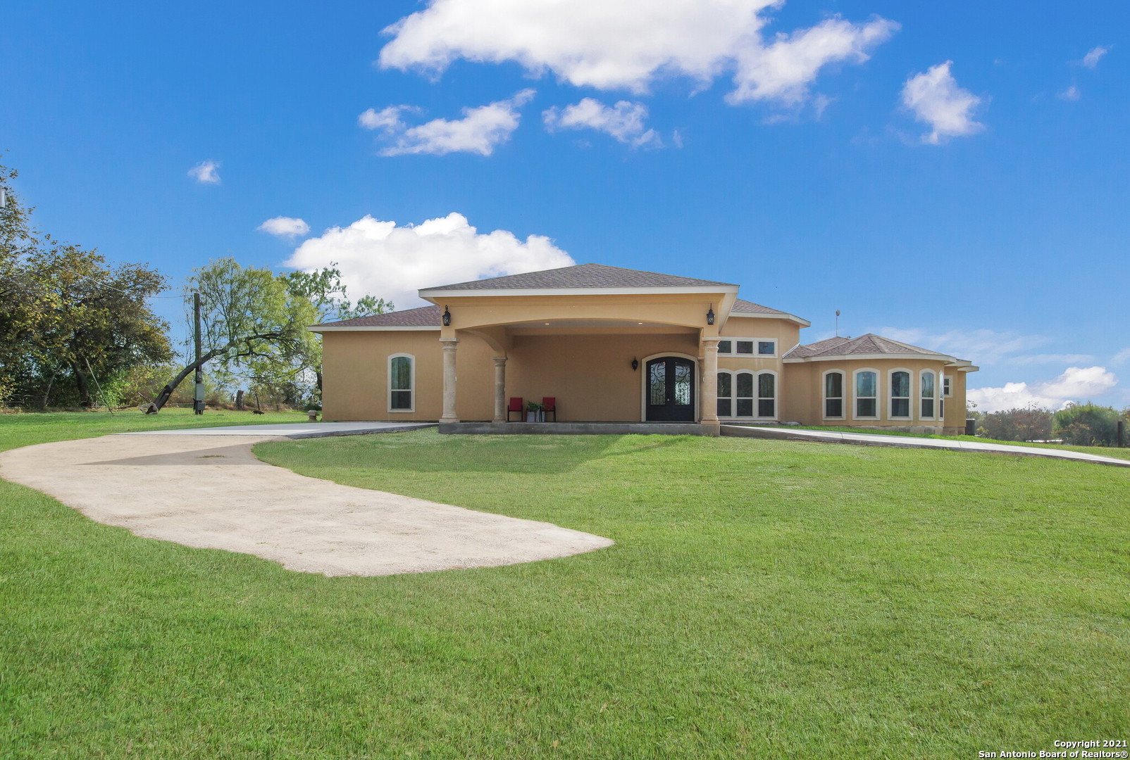 Magnificent Home & Gorgeous Property! Enjoy country living & plenty of space in a 3800 sqft Custom Home on 3.88 acres, a 900sqft 2/1 Guest house, and 1200 sqft large Garage/Shop that even has an office, bathroom & shower. Be impressed w/ the 16 ft High Ceilings & Beautiful Chandelier. Fall in Love w/ The Exquisite attention to detail w/ Tiered Ceilings, Gourmet Kitchen, and a perfect layout for enjoyment & entertaining family and friends. You will not want to leave after seeing the masterfully designed Chef Large Kitchen w/ custom Granite, Cabinets, and 3 stoves. The Master Suite could be what you are looking for w/ patio access to the backyard Oasis & the large stretched covered patio. Seeing the Guest house will increase your love for the property. Walk into the dream Shop that will allow you to fulfill your imagination and create w/ High ceilings, insulated walls, an additional office space, and shower. Best of all...It will feel like home!!