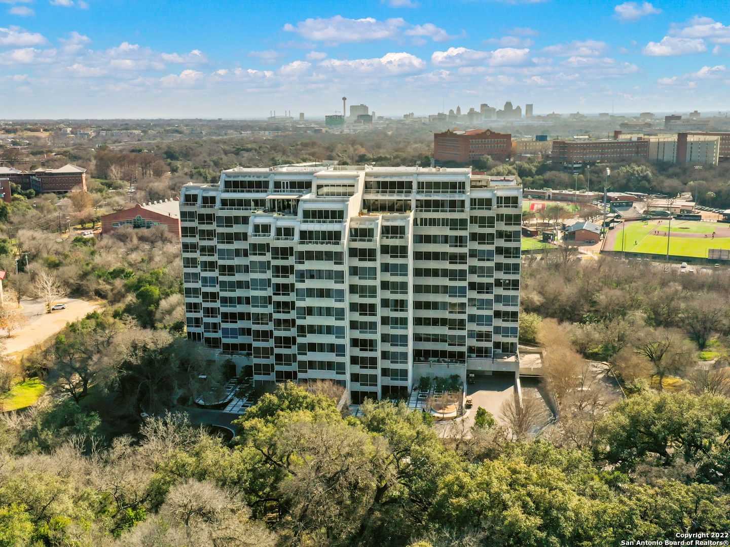 Luxurious high-rise living found within prime Alamo Heights location at the Patterson. Stunning panoramic views and ample natural lighting flooding the interiors with great views of the river. Open concept living with high ceilings complete with a gourmet kitchen with extensive cabinetry space, gorgeous hardwood floors and upgraded fixtures. Oversized master retreat with private balcony, large bathroom, double vanities, and large walk-in closet. Spacious guest bedroom appointed with the same luxe finish out. Word class amenities to include 24/7 concierge, private pool & party room, gym, tennis courts / pickle ball, library, conference room and walking trails