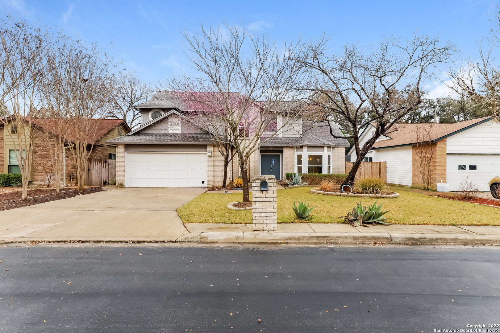 This San Antonio two-story home offers a two-car garage. This home has been virtually staged to illustrate its potential.