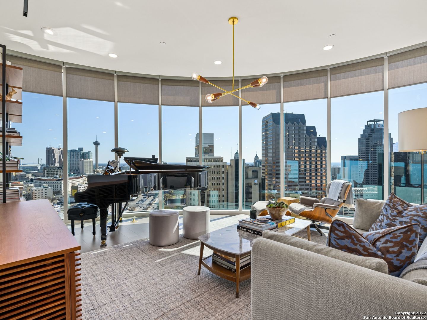 This most coveted floor plan at The Arts Residences in downtown San Antonio has spectacular skyline views from an impressive, curved wall of glass. The Picasso, a 2,126 sf residence with two living spaces and a balcony with sunrise views. Each of the 3 bedrooms has a private bath and nice separation from the other bedrooms. The kitchen has sleek all-white cabinetry with quartz countertops, Italian Pedini cabinetry, Thermador appliances, and gas cooking. This residence has been customized with designer wallpaper, light fixtures, electric shades and built-out closets. Two parking spots and two storage units are included.     Located above the Thompson Hotel, amenities like 24-hour concierge, valet parking, and optional housekeeping and linen service offer a low-maintenance lifestyle. Residents have full access to the Thompson pool with cabanas, bar, and cafe. The hotel spa has a steam room and sauna and offers in-home massages. Other services available include dog walking, car detailing, personal shopping, housekeeping, linen service, and dry cleaning. While LandRace offers riverside seating downstairs, The Moon's Daughters has rooftop dining and cocktails upstairs. Located on a quiet part of the river next to The Tobin Center for the Performing Arts, residents enjoy preferred access and ticket purchases to all shows at The Tobin. Come experience The Art of Living Beautifully.
