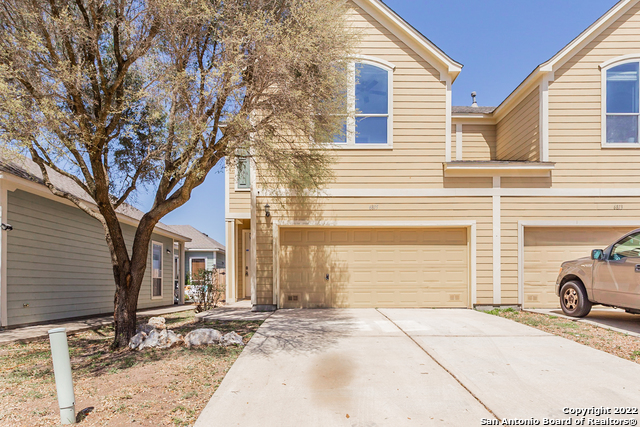 This San Antonio two-story home offers a two-car garage. This home has been virtually staged to illustrate its potential.