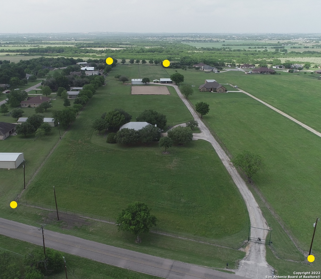 Horse lover's dream property. 2 separate homes on 10 acres. Immaculate and meticulously maintained with everything a person could want or need in highly desirable Marion TX located in Guadalupe County. 10 acres, 2 houses, 2 outbuildings/shops, 4 stall barn, arena, 3 pastures, and coastal fields used for hay production. Main house is 2893sqft and the guesthouse is a one bedroom 1080sqft home that is perfect for the parents. The barn has indoor/outdoor wash racks, large tack room and attached hay storage. Entire property is fenced and cross fenced. Income producing potential as there is a huge demand for horse boarding facilities and rental properties (second home).