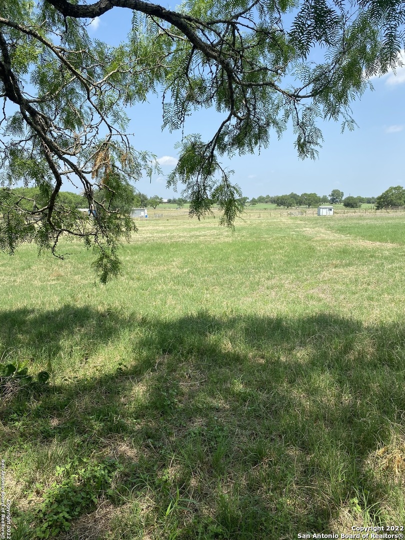 One of a kind 10.61 acres to stretch out on! Build your dream home, bring a manufacture home or build a barn dominium. So many possibilities. Minutes from San Antonio, City Base, Floresville, and Calaveras Lake. ECISD. Dual Counties. There is a small area in the FEMA 100 yr flood zone in the front where driveway is and bottom right corner by the tank that the majority stretches on to tract 1. Hurry don't miss out on this one with endless possibilities!