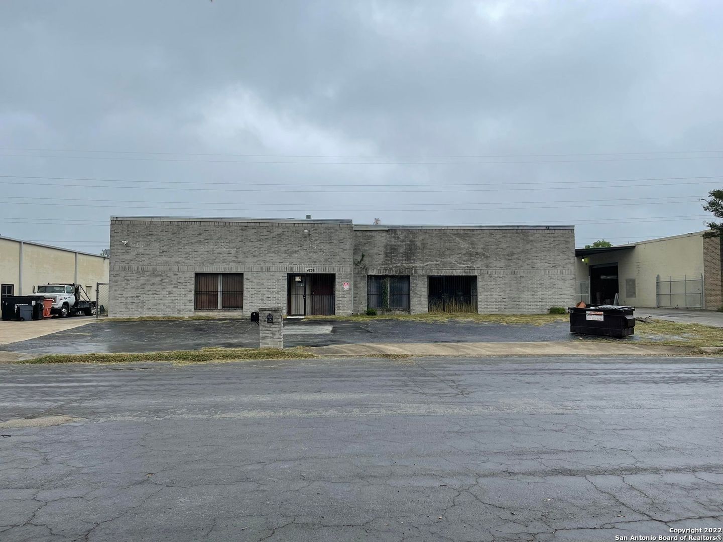 Have you been looking for an Office Warehouse Flex Space with easy access to IH-35 or Loop 410? Come and check out this wonderful location that will be ready for occupancy within 30 days.  Front entrance opens up to a kitchen and open area that would be great for a conference room, bullpen or training area.  There are 5 private offices and 2 Full Bathrooms with Walk In Showers. The shop features 16 Foot Clear Height Ceilings as well as mezzanine for storage. There are two Grade Level Roll-Up exterior doors that measure 12'Wx16'H & 16'Wx12'H.  There is also an exterior dock-high ramp for unloading trucks.  3 Phase Power.  Block Exterior and Flat Roof.  Fenced Yard.  I-2 Zoning. 0.51 Acres.  Sold As-Is.