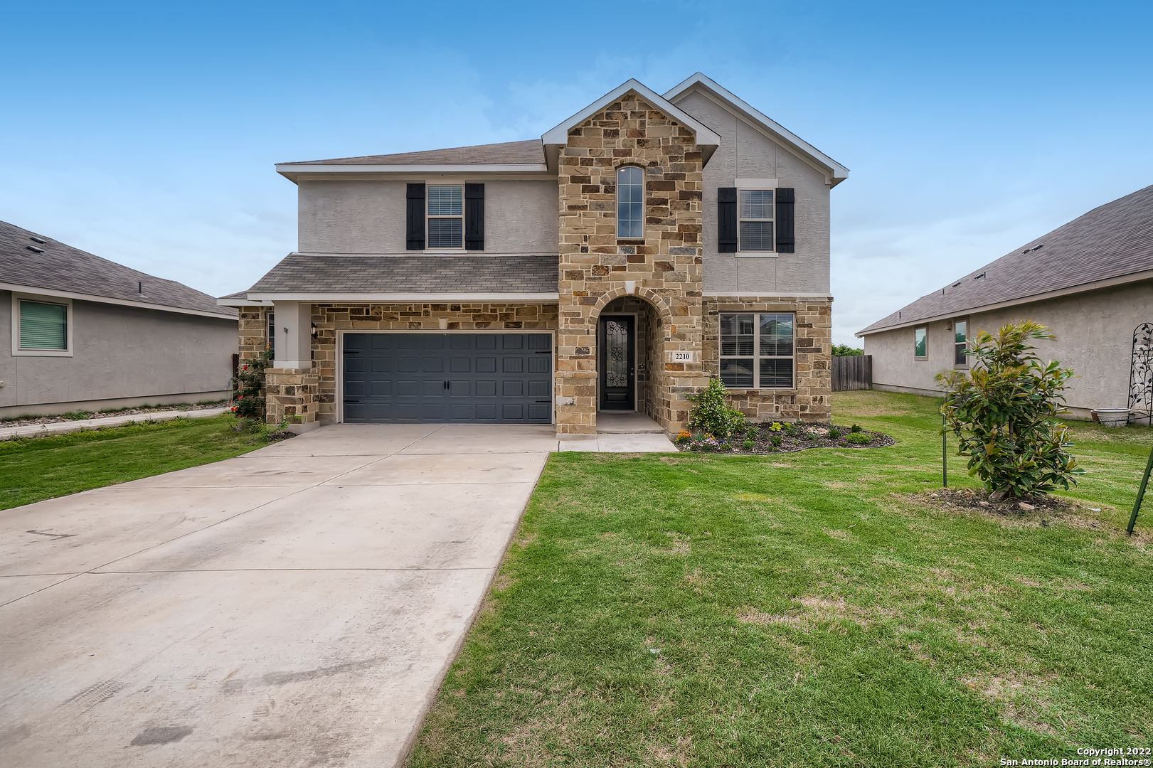 Click the Virtual Tour link to view the 3D Tour. Nestled in a nice cul-de-sac this gorgeous two story home was just built in 2019, has a greenbelt to the back, and is ideally located in NEISD with charter and private schools nearby, and with instant access to both highways 281 and 1604.  The house has many added on features, such as 27k in Solar Panels, high quality water softener with reverse osmosis filter in the kitchen, sturdy shelving and workspace in the oversized garage, as well as a storage shed in the back yard.  You'll first notice a beautifully manicured lawn kept up with the built in sprinkler system and backyard drip heads for the gardens. Step into the two story foyer and see a room that can easily be used as a dining or sitting room or an office! Enter a wide open floor plan with ample space provided by a large living room dining room combo overlooking the gorgeous kitchen. Beautiful cabinetry and large granite island coupled with a large breakfast bar and gleaming stainless steel appliances, including gas oven, make the kitchen an eye-catching feature. The expansive two-story living room features a gorgeous fireplace and numerous windows that floods the home with warm natural light. The first floor primary bedroom features high ceilings while the ensuite is impressive with a garden tub, his and her vanities, separate shower and two large walk-in closets. Head up stairs to check out not one but two extra living spaces to make your own! Four upstairs bedrooms and two full bathrooms ensure space for everyone's needs. Don't forget to head outside to the fenced in backyard and see the covered patio with built in gas line for your grill or outdoor fireplace.  Enjoy the beautiful Sienna neighborhood pool, playground, and community center during the hot Texas summers.