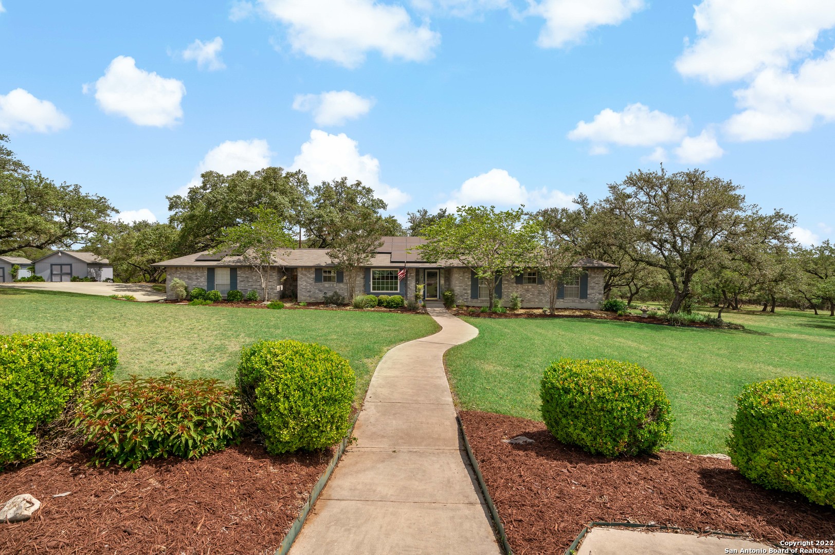 **Reduced Price** You have been waiting for this Home! WOW!  A hidden gem at Lower Smithson Valley and Bulverde Road. Great Location for shopping, dining, and in Comal ISD.  A lovely 3 bd/2.5ba/2 garage home with approximately  2,299  sq.ft. sitting in a park like setting on 2.32 acres. The acreage gives you  breathing room from neighbors and the backyard is great for entertaining.  Situated on quiet one way street in Windmill Ridge Estates with "No" HOA. The home offers Off Grid amenties like Solar Panels, Septic, Well, 3,000 gallon reservoir water tank, and has an installed receptacle port for a generator in the garage.  The home has it all, for self contained living.  The living room is beautiful with its vaulted ceiling and large wood burning fire place which has french doors that opens out to its beautiful wood deck which  allows you to enjoy the serence peace with large mature oak trees, birds, and wild life.  Don't miss Out. Call your agent today to show you this home!