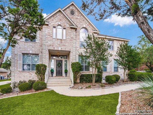 This beautiful Boerne home provides a place where you'll feel worlds away from the everyday grind. Tucked onto a .82 acre lot and backing to a serene green space, this generous 2-story exudes a comfort that you can only find when you are home. As you step inside, the feeling of light and space will surround you with soaring ceilings, abundant natural light, and a thoughtfully designed, open concept floor plan. A formal dining area sits front and center, providing an ideal space for lively gatherings and intimate dinner parties. At the front of the home, there is also a private office for working from home. The dining area connects effortlessly to the kitchen for ease of serving meals. The finishes in the kitchen are beautiful with granite countertops, rich wood cabinetry, tile backsplash, and sleek stainless appliances that include a gas cooktop, built-in oven, and microwave. The huge kitchen window above the sink showcases sigh-worthy views of the hill country. Curl up for a night of movie watching and your favorite snack in the comfortable living area that boasts a grand stone fireplace, engineered hardwood floors and a wall of windows. The upstairs encourages relaxation with a large game room, balcony, all 4 bedrooms, and a private office space. The game room is your entertaining hub with a wet bar with a beverage fridge and a door that leads to the balcony where you can lounge and take in the expansive night sky. The oversized primary bedroom provides a quiet space for you to retreat to in the evenings. An attached office can also be used as a nursery, media room or home gym. Prepare for your day or pamper yourself in the ensuite bath with a dual vanity, soaking tub, and separate shower. The beautifully manicured backyard will be one of your favorite spaces to spend time. Enjoy the wildlife that visits the property from deer, foxes, squirrels, and many colorful birds or enjoy the array of colors that fill the sky each morning from the expansive, stone patio. Additional features include a RO and upgraded water softening system and a temperature controlled 3rd car garage. This home is conveniently located near i10, The Rim, La Cantera, and Boerne. Come live your best life in this incredible home!