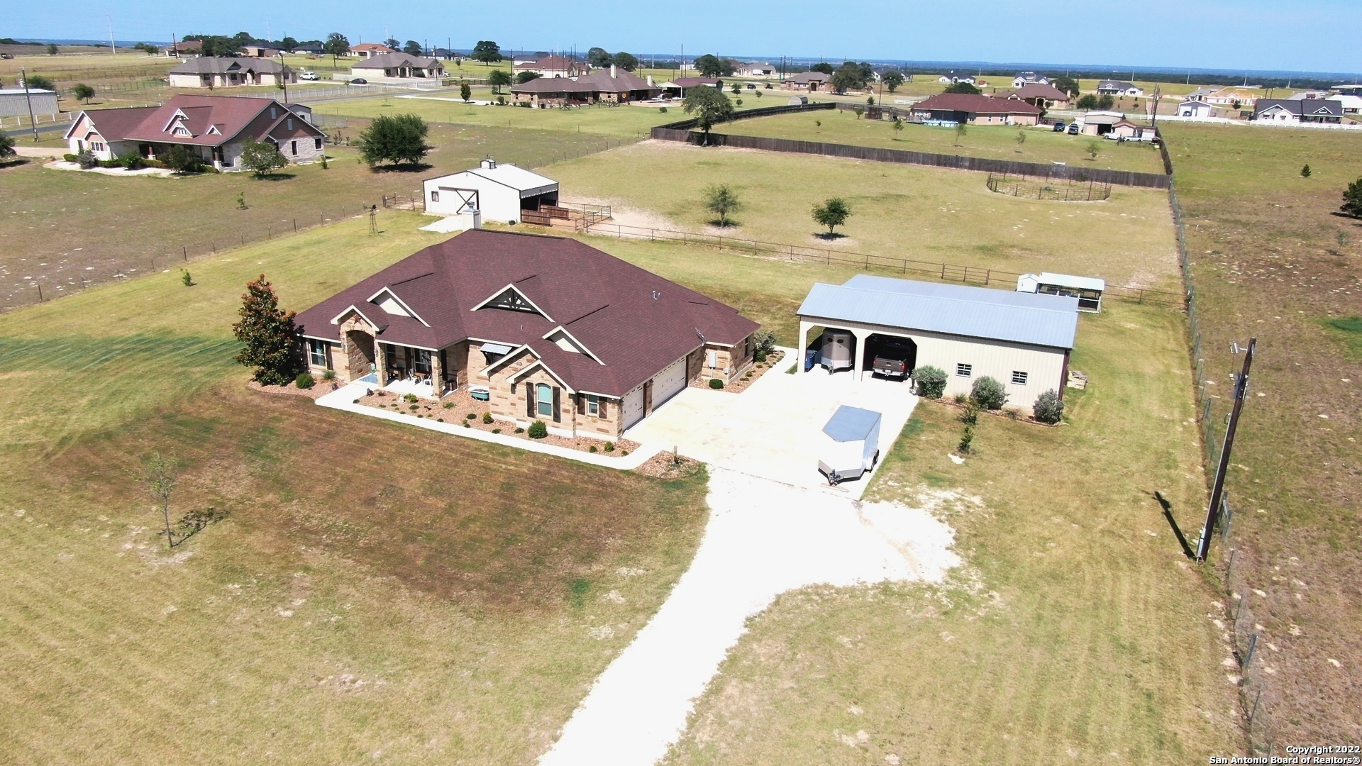 **Horse/Animal Friendly Property** w/A Hilltop Setting & Great Views on 3.04 ACRES that is Fully Fenced & Crossfenced w/Decorative Entry Gate & Opener in Triple R Ranch Subd,No Hoa dues or City taxes,Low 1.9% Tax Rate..**This is one of those Move-in,Unpack & Relax Type Home** Nearly Everything's DONE to Include Fencing,Landscaping w/Sprinkler Sys,Out-Bldg's,Workshop,Window coverings,Chicken Co-op & MORE..Approx 50x25 *Metal Barn/Multi Purpose Bldg* w/Covered Pens/Stalls w/Turn-outs,Wash rack & Tach Room *Approx 25x25 Fully Insulated Metal Bldg Workshop* 25x25 Covered Metal Carport * 36x25 Attached 3-CAR GAR w/Epoxied Flooring and 50x20 Covered Metal Equip Storage area...Approx 2700sf *Very Clean 1-Owner 4-Side Rock Ranch Style Hm that Displays a Ton of TLC Thru-out,Ceramic Tile Flooring & Granite Tops *Thru-Out* Very Open Floorplan w/Raised Decorative Beamed Ceiling,4-BD (Split bd plan) & 3.5 Bathrooms,16x13 Island Kit w/Dbl Ovens,Cooktop,Microwave,42" Custom Cabinets,Peninsula Style B'Fast Bar w/Rocked Facing,Walk-in pantry,14x11 B'Fast nook AND 13x12 Dining Rm or 2nd Living area,2-Wood Burning Fireplaces w/1 in the Approx 30x16 Covered Patio/Outdoor Living area that also has a Wet-Bar,Bathroom Access & Add'l 36x16 Concrete Patio for Entertaining/BBQing,17x14 Main Bd w/16x12 Ba that has 2-Walk in closets,2-Sink Vanities,Jetted tub & Tiled Walk in Shower,The Other 3-BD (13x11,12x11 & 12x10) have Good Sized Closets,HM has Security Sys,Central Vac Unit & FIBER OPTIC INTERNET,Gvec Electric & SS Water Co..Take a Look I Believe You Will be Impressed..Shows like a Model Hm...