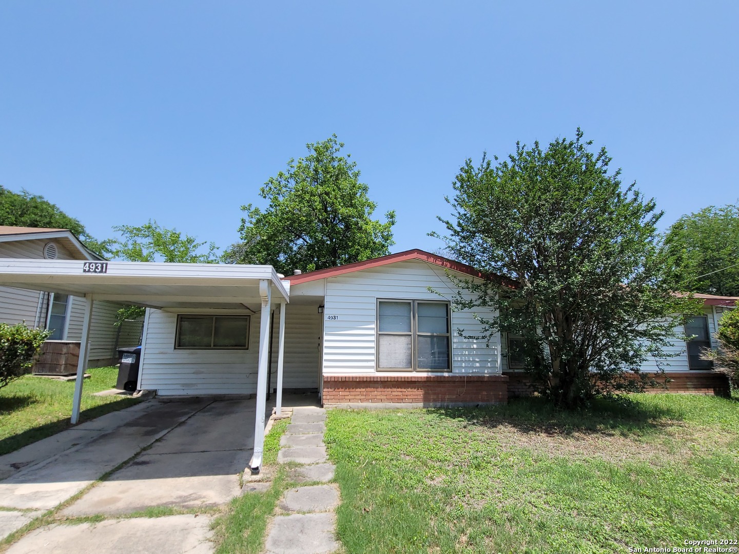 Great starter home or perfect investment property.  3 bedroom 1 bath with converted garage, all tile flooring and open floor plan.  Large fenced  yard with carport.