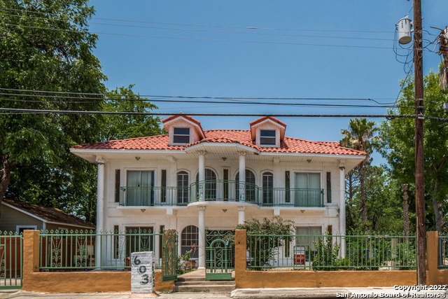 Spanish colonial two story home, stucco exterior, three bedrooms and three baths.