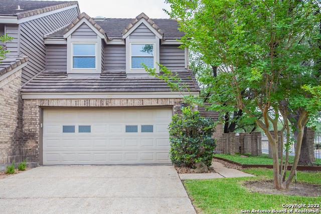 This San Antonio two-story home offers a two-car garage.  This home has been virtually staged to illustrate its potential.