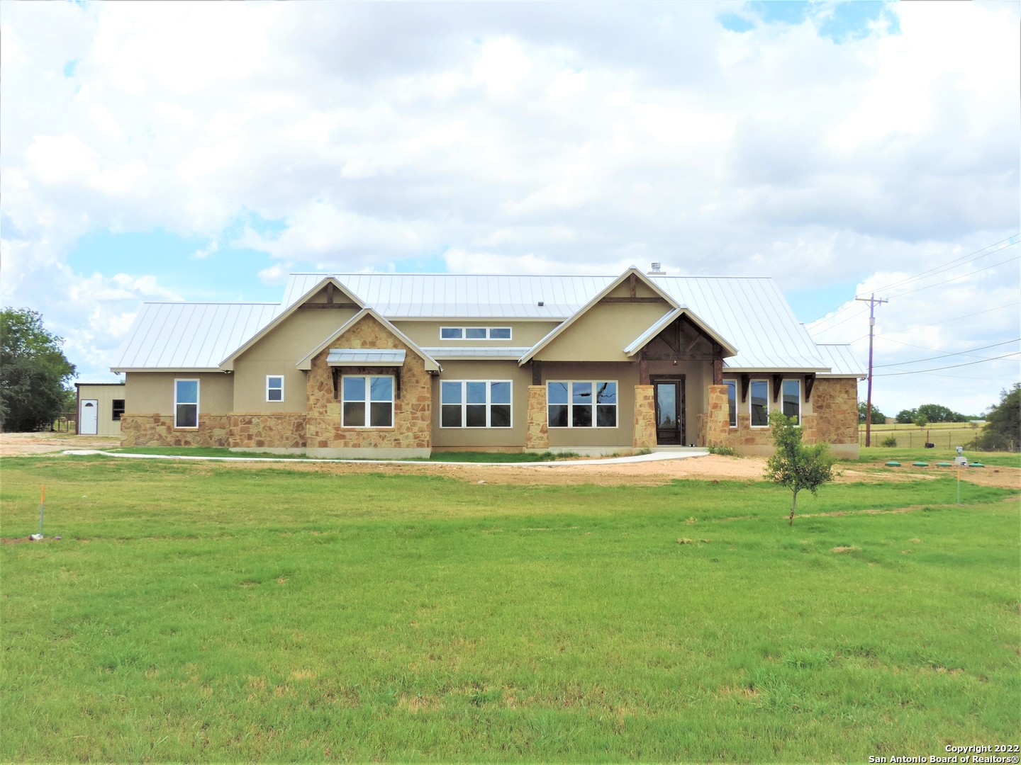 GORGEOUS OPPORTUNITY TO OWN THIS NEW ONE-STORY CUSTOM HOME ON A 1.9 ACRE CORNER LOT!!  THIS NEW HOME FEATURES OVER 3,200 SQUARE FEET OF LIVING/ENTERTAINING SPACE. NEW OWNERS WILL ENJOY QUIET COUNTRY LIVING/OPEN ISLAND EAT IN KITCHEN/FLOOR TO CEILING STONE FIREPLACE/EIGHT FOOT DOORS THROUGHOUT/SOARING GAMEROOM CEILING/SUNROOM/BEAUTIFUL OWNERS RETREAT WITH A CUSTOM BATH/WALK-IN CUSTOM SHOWER AND A GREAT SIZED WALK-IN CLOSET.  READY FOR A QUICK MOVE IN.  NEW SEPTIC SYSTEM. THIS CUSTOM HOME SIMPLY SPEAKS FOR ITSELF.  SELLER IS WILLING TO ENTERTAIN OFFERS FOR THE AQUARIUM.  VERIFY ALL MEASUREMENTS.  CONTACT US FOR YOUR EXCLUSIVE SHOWCASING TODAY.