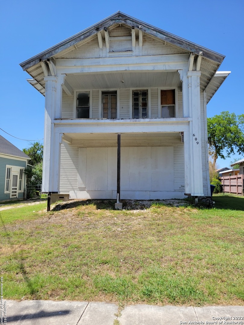 In the historic Dignowity Hill district.  A newer San Antonio hotspot for redevelopment.  Built in 1912 and may have served as a WW II boarding house.  Two interior staircases and multiple bedrooms and bathrooms.  Interior has been stripped down to the studs and some flooring removed while installing new piers and leveling house.  High ceilings. Home is a blank canvas that can be reimagined into whatever the Buyer desires.  Do not rely on room numbers, uses, or measurements.