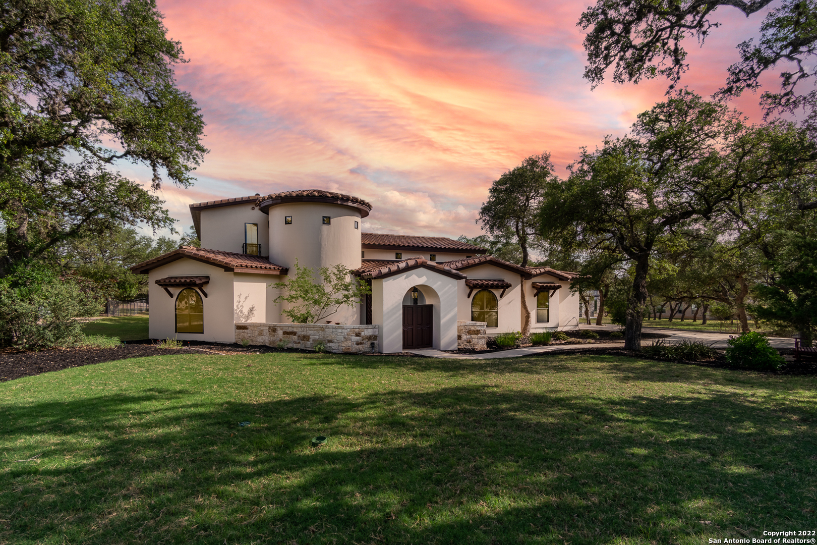***OPEN HOUSE:  June 4, 11 am - 1 pm***. Gorgeous one of a kind Spanish Mediterranean inspired home in the quiet gated community of Glenwood located in Bulverde.  Situated among dozens of oak trees on an acre is this beautifully landscaped 4 bedroom, 3.5 bath home complete with two private courtyards and unique features you won't find anywhere else!  Enter the private gate on the front courtyard and you'll notice a unique fountain the homeowners found in Mexico.  Pass by the columns through the custom hand carved rounded front door (imported from Guananato Mexico) and into the rotunda style entry way where you will find a beautiful sweeping staircase lined with Spanish - Mediterranean tile.  From there you'll enter the main living area of the home where the high ceilings are adorned with beautiful beams and custom designed Chandaliers from Italy.  The kitchen is complete with a large island, granite counters, a breakfast nook and gorgeous custom cabinetry.  Curl up next to the stunning floor to ceiling fireplace in the winter while enjoying the view to your very private backyard courtyard with an outdoor kitchen and entertaining space.  This beautiful home is a must see!