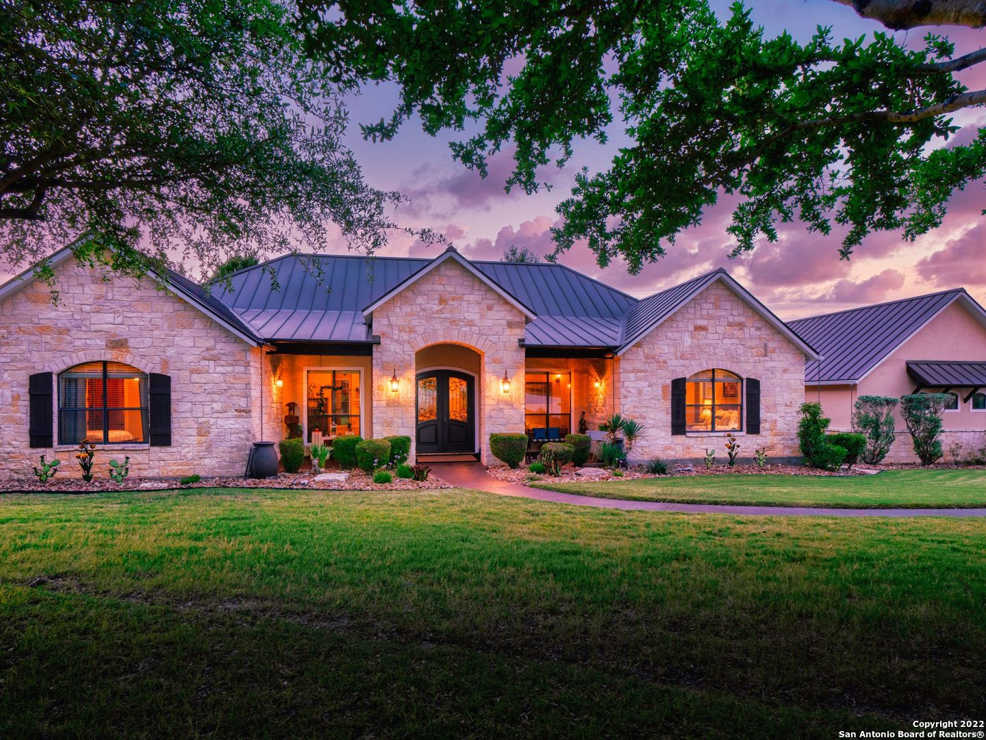 Tremendous Texas Hill Country living on 4.4 acres within the gates of Cordillera Ranch. This home has over 3,800 S.F. with plenty of space and privacy. Exquisite finishes and craftsmanship are found throughout including a stone gas fireplace, private office with patio, gas cooking, open floor plan, and stone accents. The primary retreat is complete with a sitting room and well appointed bathroom en suite with access to the laundry room. Additional guest suites are located on the opposite side of the home with large walk-in closets and bath. A separate mother-n-law suite with a full bathroom, kitchen, and living area can be accessed through a seperate entrance on the side of the home. Additional detached 1,753 S.F. workshop and garage with one of the only RV/boat storage garages in the Cordillera Ranch community. Multiple patios positioned around the home with a hot tub and deck looking out at the back yard views. Beyond this extraordinary home, enjoy the resort-style living within Cordillera Ranch that includes amenities like the Golf Course, Country Club, a private Guadalupe River park, and endless trails for walking, riding, or biking.