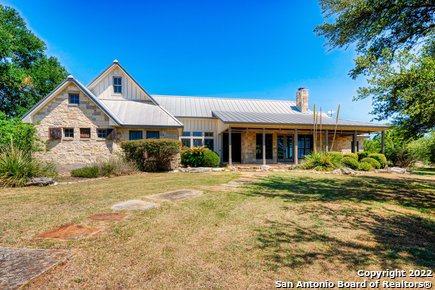 This exquisite Robert Thornton Custom Home was designed by architect Dave Morris and is situated on 4.92 acres in the Texas Hill Country's most exclusive country club community, Cordillera Ranch. The property features outstanding privacy and long-distance southern views, as well as updated flooring, paint, lighting, and quartzite counters in the kitchen. The 3,655-sf home has an open floor plan with 4 bedrooms, 4 bathrooms, a powder room, and a home office. The spacious kitchen is complete with a Wolf stove and Sub-Zero refrigerator. Custom wood cased windows are throughout the home. The guest suite upstairs includes a full bath, kitchenette, bedroom and living area.