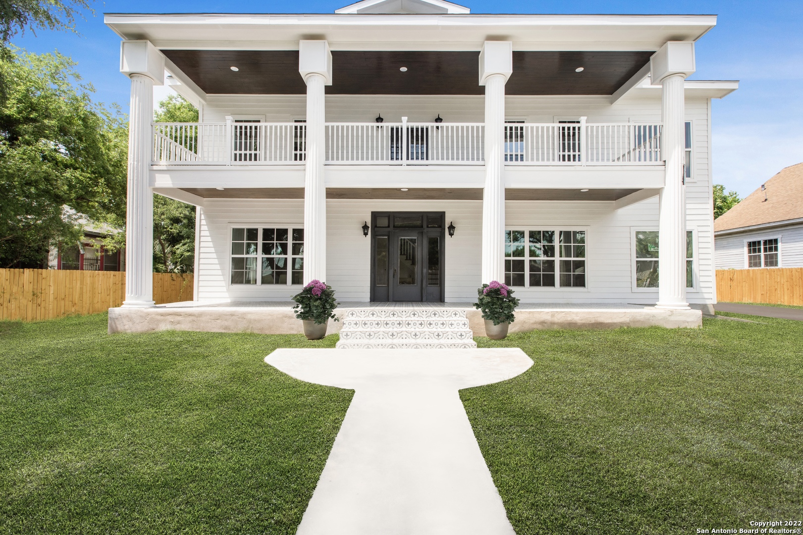 This grand and elegantly restored 1930s Colonial multi-family home sits on a double lot. It offers  5,926 square feet of rental income potential steps away from San Antonio's revered King  William and Southtown communities. The MF-33 zoned property includes 4 units just 5 minutes  from the center of downtown - perfect for young professionals, couples, small families, or vacation rentals. Two units are 3 beds/2 baths, and two units are 2 beds/2 baths. All 4 units are  completely renovated, blending historic charm with modern style. Upgraded features include restored hardwood floors, exposed shiplap, stainless steel appliances, double-paned windows, quartz countertops, and designer-grade tile. The residence's two-story covered front porch  flanked by grand columns provides a warm welcome home and the perfect spot to relax, overlooking the property's mature trees. This rare find is sure to be popular among future long-  term or short-term renters!