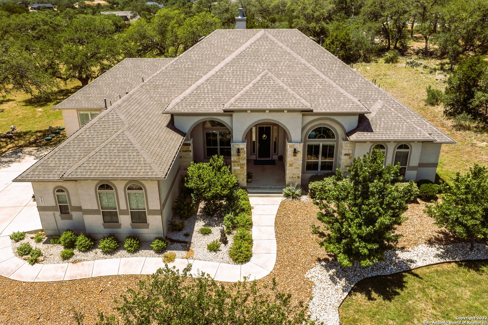 MUST SEE. Easy Hill Country Living found here in this gorgeous and spacious 5 Bedroom/4.5Bath/3 Car Garage/3,801 sf custom home on over 1 acre, set among the mature oaks with amazing sunset views from your back patio that will rival Tara in Gone with the Wind! Come discover the essence of Texas Hill country lifestyle and all this home has to offer from moment you enter with soaring ceilings, wall to wall windows in the 2 living areas, both with fireplaces that over look the Oaks, and the chefs delight kitchen with butler & wet Bar and formal & casual dining areas, featuring gas range, double ovens, 2 islands perfect for family gatherings and entertaining indoors and out. Spacious luxe owners suite wing with bay sitting area and 3 closets. 2nd bedroom has its own loft. 3rd & 4th bdrm suites w/private bath.  And in one of the most sought after communities in the TX Hill Country offering miles of hiking/biking/jogging /walking nature trails, Clubhouse with olympic size pool and a lazy river to float, community events, 8,000 sf state-of-the-art fitness center, sports courts, concerts, and so much more. Located between San Antonio and Austin in New Braunfels. COMAL ISD. Low property taxes. Come make this your home and start enjoying the Texas lifestyle today!
