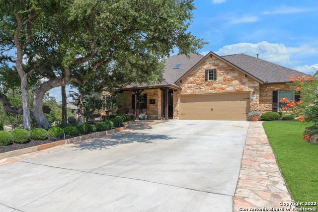 This gorgeous home is nestled in the Kinder Ranch subdivision situated on an oversized corner lot. A former model home, this property has been meticulously cared for with lavish improvements to show. Upon arrival, a beautifully landscaped lawn showcases vibrant greenery. The home unique is clad in stone with contrasting trim and shutters. The picture-perfect front porch is splendid for a morning cup of coffee while watching passersby. Inside, spacious common areas allow for entertaining at ease. Three full bedrooms and two and a half baths create ample room for loved ones. The dedicated living area opens to the dining space and is conveniently located near the kitchen with a breakfast area. To the primary, homeowners will revel in the spa-like en suite with a walk-through shower and a soaking tub. The theater room is perfect for grand experiences with wired surround sound and 6 recliner movie chairs. A wired speaker system with an amplifier can also be utilized throughout the home. Shiplap is featured in the game room and flex space. Dedicated office space can be closed for added privacy and has a stunning stone wall feature. Two secluded bonus room can be accessed through the garage and are not included in the square footage. Each dwelling offers full heating and air conditioning in addition to crown molding and fully finished details. Convenient access to the outdoors can be found through hardwood framed bypass windows. Outside, revel in the resort-style backyard with a glistening pool and water feature. The large covered patio is great for al fresco dining next to the bee-cave-rock fireplace. The backyard also highlights low voltage accent lighting and a beautiful water feature and garden. In addition to all this home has to offer, enjoy an On-Q intercom system, tilt-out double pane vinyl windows, alarm system with video cameras, two-car garage, Safe Rack Storage system, Water Guru pool monitoring system, and much more. Come view this fabulous home today before it's too late!