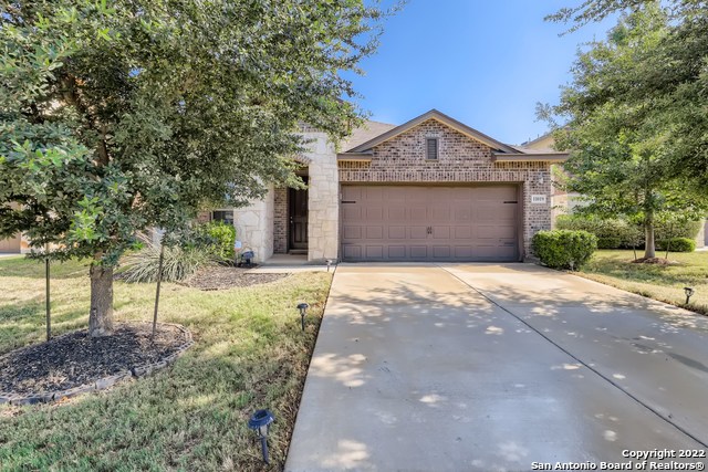 This "home-sweet-home" is a 1.5 story that has been well-maintained and is ready for its new owners. Features include a stylish kitchen with granite countertops, rich mocha cabinets, an island overlooking the main living area, an office, a laundry room, four bedrooms, and three full bathrooms with a loft area on the second level. The split floor plan features a spacious master bedroom on the main level with bay windows, an en-suite bathroom with a walk-in shower, and dual vanity. Home is energy efficient with spray foam Insul, EnergyStar appliances, Programmable Thermostat, low E2 Vinyl windows, two water tanks, and a water softener. The back patio is perfect for entertaining. A flat backyard that backs up to a small greenbelt offers homeowners privacy. Storage unit in the backyard for additional storage. Champions Park is close to the Dove Creek shopping area with easy access to 1604, Hwy 90, HWy 410, Lackland AFB, Sea World, and shopping!