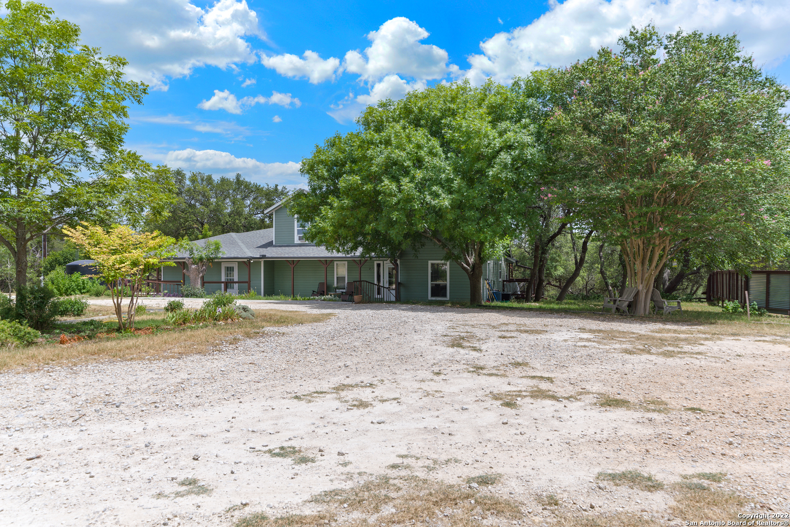 This Expansive property includes 9.76 Acres and 3 dwellings on site. The main house features an impressive 9 bed/4.5 baths and 3200 sqft. The second home includes 3bed/1bath and 1,000+/-sqft currently leased until 4/23/2023. The third home includes 1bed/1bath and loft in 900+/- sqft and currently leased until 11/22/2022. The property boasts mature landscaping, fruit trees, an electric security gate, deer fence, small pond, 410' water well, and New septic system. The home includes the option to purchase all furnishings. This property offers many opportunities to generate revenue or provide an impressive homestead on idyllic acreage.