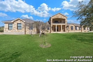 This 5 bedroom, 4 bath home was built with quality and care situated on a sprawling 10.04 acre property with room to roam in the highly desired Star Oaks Ranch gated subdivision. The main house has a grand entry, with Italian tile throughout, Pella windows and doors, tons of upgrades, a large open gourmet kitchen, large family room, loads of closet and storage space, an oversized covered patio that offers beautiful country views with an included outdoor kitchen, an in-ground pool and hot tub with solar heating. The entire downstairs is wheelchair accessible with wide hallways and 36" door openings.  For those seeking room for an aging parent, or live-in care taker this home also has an attached suite on the main level with its own separate garage, primary entry, and driveway on the opposite side of the home. This additional suite was added in 2020 and offers its own living room, master bedroom, walk-in closet, and kitchenette.  Pride in ownership is evident with regular maintenance being performed.  The entire exterior has been freshly painted, the HVAC ductwork was recently cleaned, and a complete new septic system was installed in 2020. As an added bonus the Seller will leave all major appliances, including 3 refrigerators, washer and dryer. Property is on a water well reducing your cost for irrigation water.  Must see to appreciate!