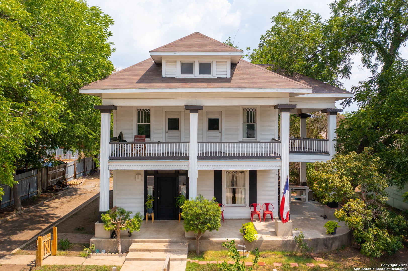 This 1920 Historical beauty, flaunts its irresistible curb appeal, highlighting the concrete covered wrap around porch offering over 300 sq ft to use for entertaining, relaxing, dinning, etc., the opportunities are endless!   This home features a 300 sq ft mother in law suite connected to the main home.  It has 1 bed, 1 bath, kitchen/dining/living space area, personal entry.  The opportunities are endless, the door can be walled off or left as is for Income producing, apt, etc  The grand foyer's elegance is displayed by its original front door, chandelier, 10 foot ceilings, 10 inch baseboards, and ravishing Original hardwood flooring.   This Historic beauty provides superior quality, design and charm to exceed all of your wildest dreams.  Just a short drive to local shopping, state-of-the-art restaurants, walking trails and state parks, this home is situated in the heart of San Antonio Minutes to Conception Park, King William, The Pearl, Downtown, Blue Star & so much more.  Unwind after long days in your spacious jack and jill balcony, overlooking the city or walk upstairs to find a sunny loft with access to the second level personal balcony from the master bedroom.   If you are looking for a historical home with class, elegance, character, and lots of indoor and out door living space look no further, this is the one for you!