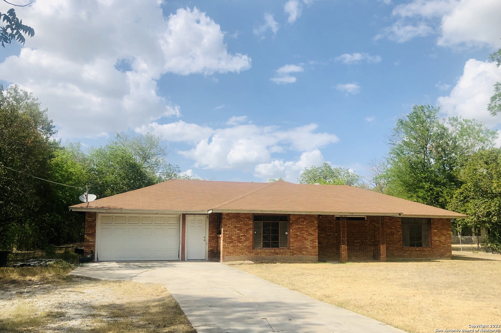 This is the property your clients are looking for!   Spacious brick home nestled under nice big shade trees. Home sits on approximately 1 acre. Property is completely fenced in. Convenient location near major highways, restaurants and shopping centers. Only minutes from downtown & AT&T Center. Show this one, today!