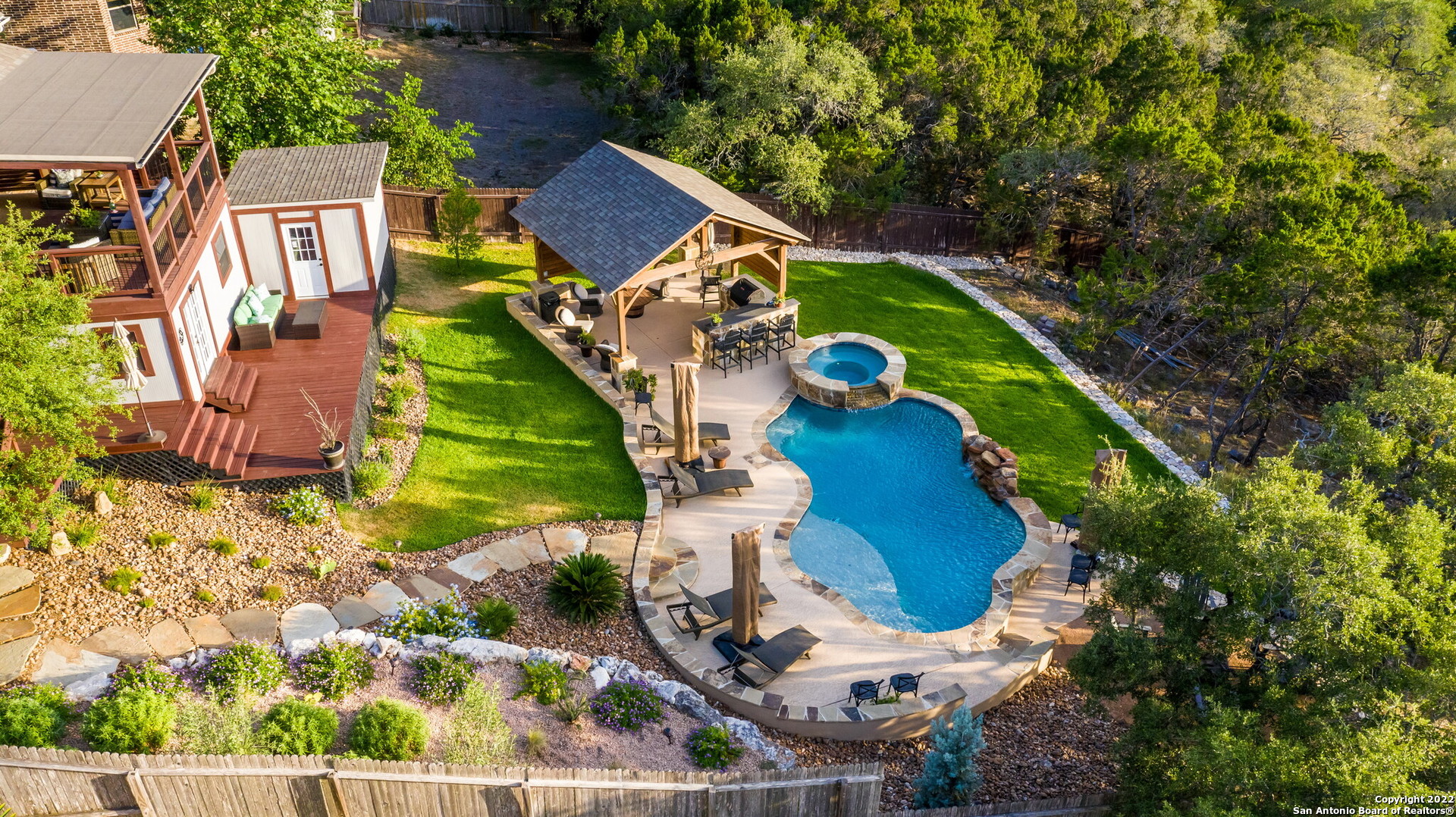 MULTIPLE OFFER situation!  Offers due Sunday 6/26 at 6pm.  This rare combination of gorgeous home & incredible outdoor space, in desirable Mountain Lodge, is a MUST SEE! It's impossible to ignore the pride of ownership in this neighborhood gem.  With 5 bedrooms (master AND 1 secondary down!), 4 full baths, office, game room & media rooms you have plenty of space to work from home, watch movies, play games, host guests, have parties... did someone say pool party?!  Prepare for your jaw to drop as you open the (custom, newly installed) plantation shutters to look outside and/or walk out onto the back patio and into your backyard oasis! If you're looking for the "wow factor", you have found it!  Outside you will find thoughtfully designed landscaping, pool with spa, pavilion with outdoor kitchen, extended patio (also plumbed for a kitchen), a shed (storage!) and wood shop.  Come see for yourself - you'll be glad you did!  Not convinced? check out the video https://youtu.be/6FIR-1HbZ3M