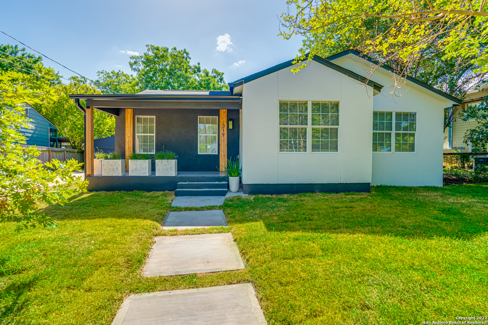 **Multiple Offers** Please submit best & final by Sunday 6/26 at 7:00 pm     **Back up offer received as well** Don't miss your opportunity to view this fantastic single story home that has been reimagined from top to bottom in the Terrell Heights community!  This newly remodeled home sits on almost a quarter acre lot and is located in the highly desirable Alamo Heights ISD.  The interior of the home features an open floorplan layout and has waterproof laminate flooring throughout.  The spacious kitchen area includes bar top seating, open shelving, granite counters, stove/cooktop with hood vent, dishwasher and large pantry.  The living room boasts plenty of natural light, electric fireplace, ceiling fan and is open to the formal dining space with plenty of seating for everybody.  The spacious primary suite has its own exterior access to the backyard with a covered porch area, ceiling fan and ceramic planters. The ensuite bathroom has a large glass enclosed shower, double vanity with wood framed mirrors and walk in closet.  The secondary bedrooms and additional full bath are situated on the opposite end of the home providing plenty of privacy for all.  The exterior of the home features a beautiful dark grey and white stucco, front porch with ceramic planters, new roof, mature trees, fresh sod, two car detached garage and a 190 sq ft shed with finish outs and controlled temperature.  The home is centrally located near major highways, shopping, dining, entertainment and much more!
