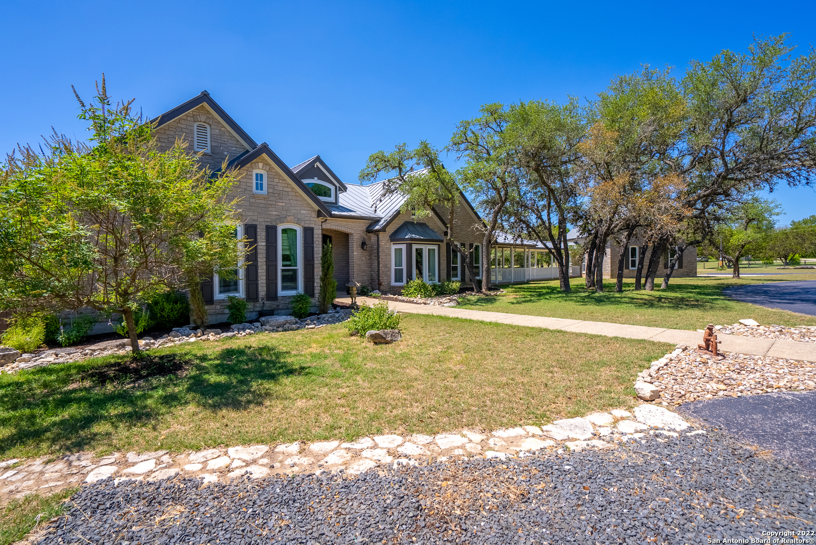 Hill Country Beauty - Welcome to this rare find in the Texas Hill Country.  No expense was spared in the building of this custom beauty.  One can find custom lighting and ceilings trimmed with 6inch crown molding.  A massive sunken family room is welcoming at the entry of this home.  Large windows show off the view of the 2-year-old heated pool/spa and in the evening deer can be spotted grazing among the trees. Off the family room is the private bar area with lots of cabinet space, wet sink, a wine cooler and hook-up for an ice maker. The gourmet kitchen comes right from a chef's dreams with custom cabinets, custom lighting, leathered granite countertops, and large stainless double Thermador ovens.  The master bedroom suite is truly a private escape with French door access to the pool.   More custom touches can be found in the master ensuite with the cultured marble-clad snail shower, whirlpool bath plus his n her walk-in closets.  Two of the secondary bedrooms have their own attached full bathrooms.  The half bath sports a custom onyx hand-carved sink. Two covered patios are provided for entertainment.  A covered breezeway leads the way to the triple-car garage.  Above the garage is an unfinished 14ftx32ft loft area waiting to be converted into extra living space or added income. This beauty sits on about 5.63  acres of partially fenced land with Ranger creek flowing through the back side of the property. See additional documents for list of updates/upgrades.  Pre-Qualification required, at request of seller, prior to showing.