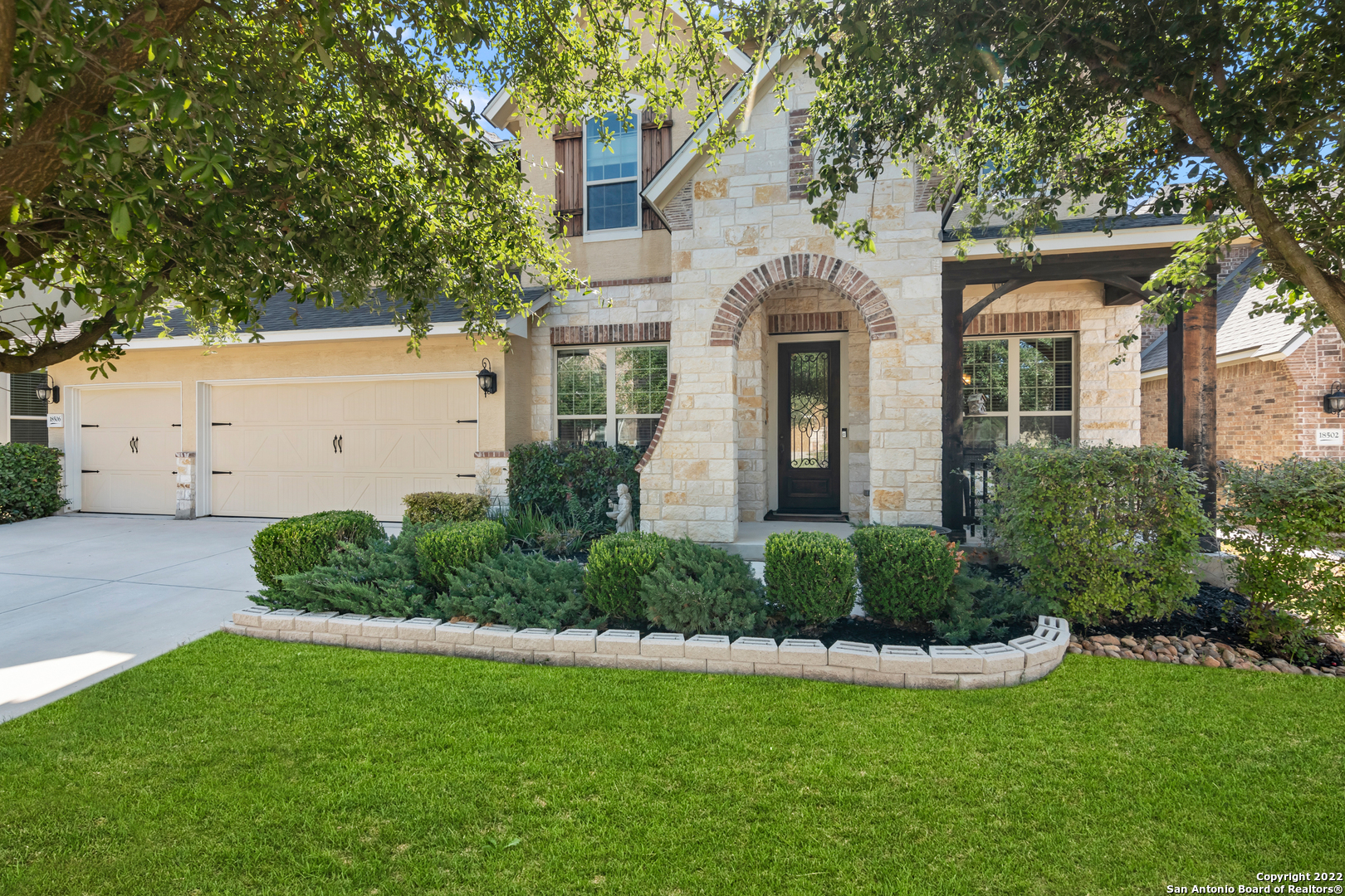 This spacious David Weekly home is located on a beautiful greenbelt lot in Rogers Ranch. As you step inside, the open floor plan makes it easy to picture entertaining at any level. Timeless details include travertine floors, high ceilings, a neutral color palette, thoughtfully placed windows, and a private study with hardwood floors off the entry. Formal and casual dining areas add flexibility to the floor plan, both flowing seamlessly into the spacious family room with stone fireplace. Just past, the gourmet kitchen features white cabinetry, bold granite counters, stainless steel appliances, and gas cooking. A wonderful mudroom is just off the laundry room. Relax and unwind in the downstairs primary suite which provides an en suite with a walk-in closet, soaking tub, standalone shower, plus dual vanity.     Upstairs is a large game room, adjacent media room, and four generously sized secondary bedrooms, allowing tons of space to spread out or host guests. Outside, a three-car garage contributes additional value to the property. Celebrate summer barbecues or birthday parties in the tranquil back yard with great greenbelt views, showcasing a covered patio which includes a fireplace plus an outdoor kitchen with gas grill and fridge.  Enjoy the neighborhood swimming pool, hiking trails and sports courts that make Rogers Ranch such a wonderful place to live.