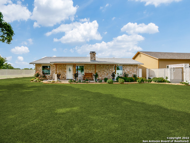 UNRESTRICTED MULTI-USE PROPERTY WITHIN 5 MINUTES OF SEGUIN AND CLOSE PROXIMITY TO IH-10.  LIVE AND RUN YOUR BUSINESS on this 5.57 acres of level improved property with an updated 2000+ SF home, outstanding 3400 SF horse barn complete with 12-14 stables, 3 separate Bermuda grass seeded pastures fenced and cross fenced, tack room and hay storage, sensational 40 X 30 detached garage/workshop designed and reinforced for mechanic's hydraulic lift addition, sizable 25 X 30 pole barn for storing equipment and just about anything.  Complete with an additional office building.  Possible uses might include Veterinarian, Horse boarding, Mechanic shop, Cabinetry and/or other wood/metal fabrication  shop or just your comfortable private horse ranchette just minutes from the home town amenities of Seguin!