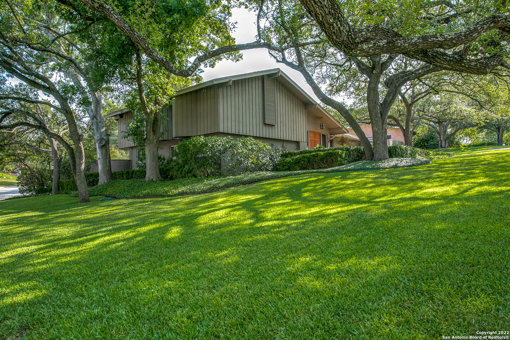 Great opportunity for a well-cared-for, one-owner mid-century modern on expansive, shady, corner lot in AHISD. Spacious living areas and formal dining room ideal for gathering. Living room has soaring ceilings, fireplace. Family room is light-filled with back yard views. Palmer Todd kitchen with breakfast room with pool views. Split level floor plan. Primary suite and private study/sitting area on upper level has abundant storage and built-ins and makes a fabulous owner's retreat. 2 Secondary bedrooms, bath and game room on lover level with walk-out to back yard. Updated double paned windows throughout. 4th Bedroom with full bath on main level. Private back yard with sparkling pool, patio and pergola perfect for relaxing and entertaining.