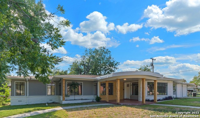 This home is one of a kind!!!  1950's charm with modern conveniences.  Original hardwoods have been restored.  This property has large rooms with built ins.  HUGE Living Room plus a BONUS room with Terrazzo flooring.  Small office behind the garage.     WINDOWS, WINDOWS, & MORE WINDOWS!!!!