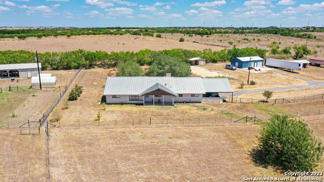 GREAT INVESTMENT OPPORTUNITY AND INCOME PRODUCING NOW!!!    Come see this ranch style property in the beautiful Texas countryside of Seguin, TX!   2 dwellings on property...home and mobile home. Home was renovated in 2015, w/additional upgrades in '16 & '17!  Complete with a workshop, shed and attached carport. Home features fireplace, open concept living/dining, high ceilings w/beams and a great Florida/sunroom to watch those Texas sized sunsets or enjoy your morning coffee on the front porch and watch the Texas sunrise! Converted garage gives you more great living space and utility space also.  Granite kitchen island and breakfast bar.  Large private master, walk in closet, granite counter with tiled walk-in shower.  Farmhouse style mobile home with open concept living and beautiful finishes throughout.  Kitchen has white cabinetry, pendant lighting and vent hood. Great utility room with window, sink and plenty of space for all your laundry needs.  Master bath features dual vanities, modern style walk-in shower and stand-alone tub.     Easy access to IH-10, Seguin, Marion, LaVernia, San Antonio and New Braunfels.