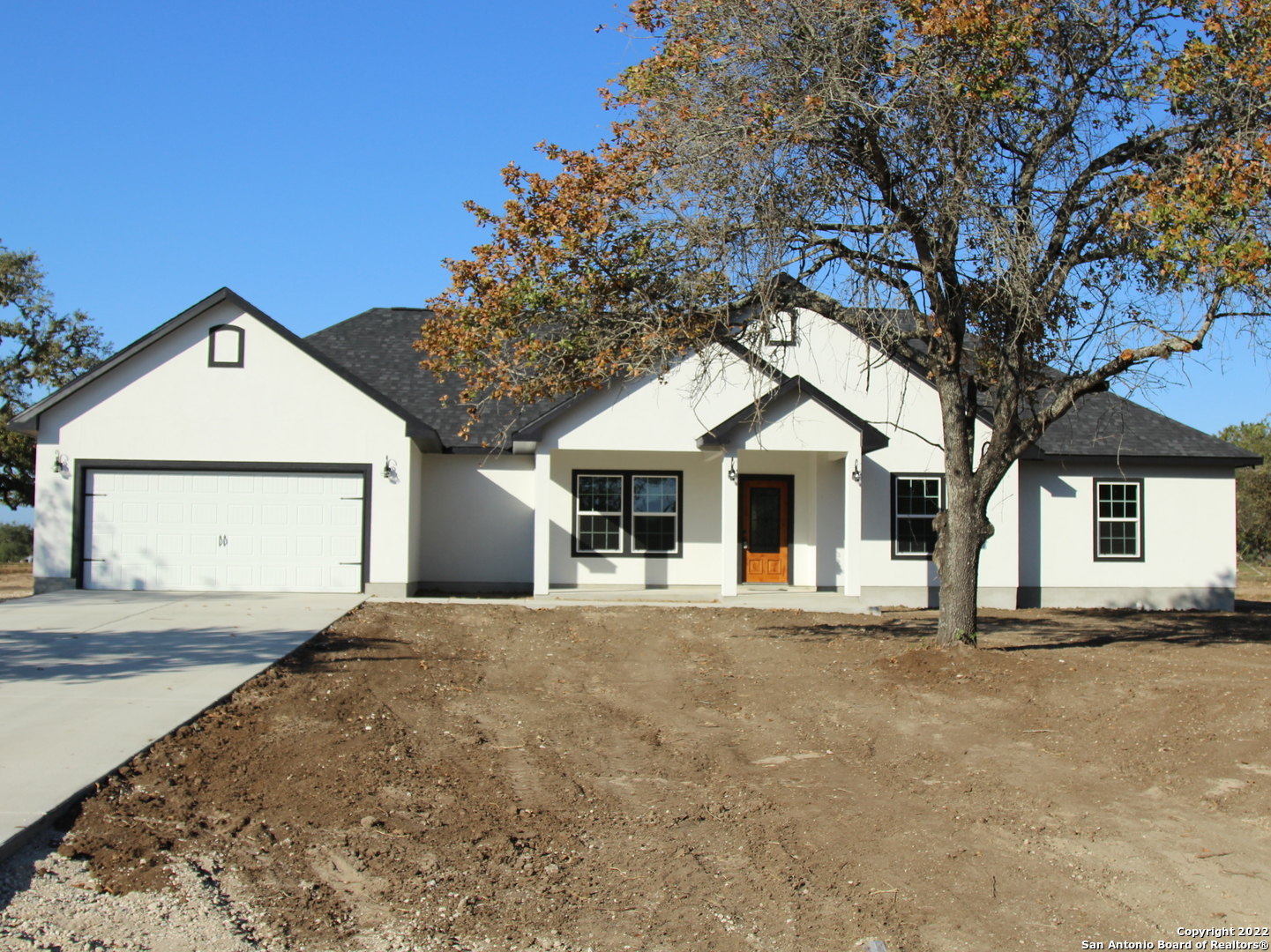 Home is under construction - sample pictures only. To be completed September - October time frame. Beautiful 4 bed 2.5 bath with an office in the much in demand subdivision of Granburg on .75 acres. Just minutes from Lytle near I-35. Exterior will feature stone and stucco with a large covered front porch and covered rear patio. Tile throughout with carpet in the bedrooms, sep tub and shower, large island kitchen, huge living room and spacious dining and bedrooms. Other features include auto garage opener, water softener connections and insulation around the garage. All measurements are approximate.