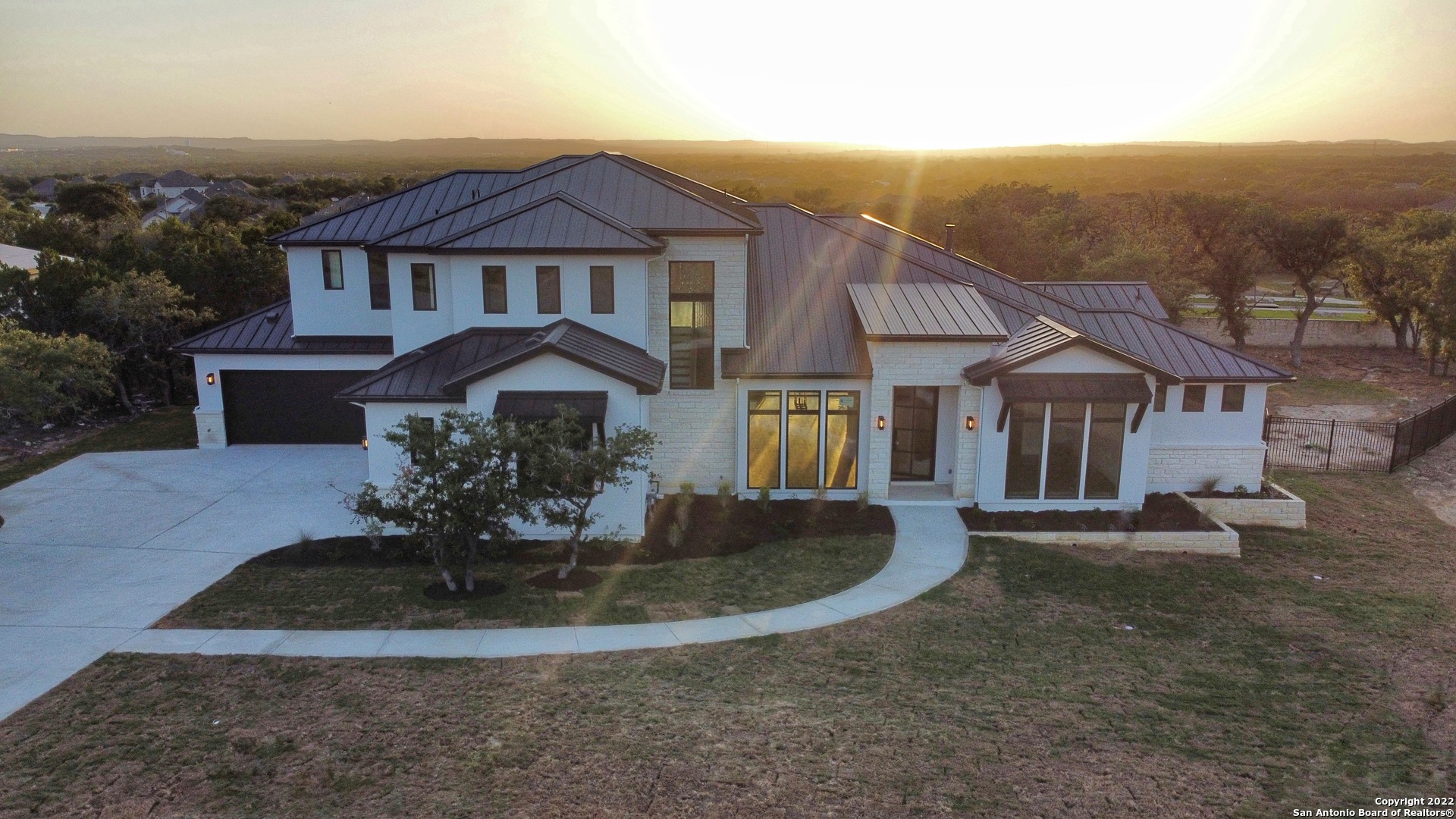 JUST COMPLETED CUSTOM 2 STORY W/ INCOMPARABLE FINISH OUT AND VIEWS VIEWS VIEWS! 5 BED/ 5.5 BATH/ STUDY/ OVERSIZED GAME ROOM W/ BALCONY/ 4 CAR GARAGE W/OUTDOOR LIVING ON .895 ACRE LOT LOCATED IN THE EXCLUSIVE LOMA LINDA CUSTOM HOME SECTION IN ESPERANZA, THE ONLY MASTER PLANNED COMMUNITY IN BOERNE. WALL OF WINDOWS IN FAMILY ROOM, LINEAR 60" FIREPLACE AND EITHER WHITE OAK HARDWOOD FLOORS, OR TILE THROUGHOUT. DESIGNER SHOWCASE GOURMET KITCHEN INCLUDES CABINETS TO THE CEILING, LUX APPLIANCES INCLUDING 48" BUILT IN FRIDGE, 48" RANGE, MICROWAVE DRAWER, WINE RESERVE, HUGE ISLAND W/ PREP SINK AND BUILT-IN TABLE, LARGE WINDOW ABOVE 45" KIT SINK FOR NATURAL LIGHT, OUTDOOR LIVING W/ GRILL GREAT FOR PARTIES. ALL BEDROOMS HAVE WELL PLACED WINDOWS TO MAXIMIZE THE VIEWS! LUXURIOUS OWNER'S SUITE WITH FREE STANDING TUB,  SPACIOUS WALK-IN SHOWER, GLAMOROUS WALK-IN CLOSET W/ ISLAND DRESSER. LAUNDRY ROOM W/ CABINETS GALORE INCLUDES SPACE FOR SECOND FRIDGE, SINK AND ISLAND. CEDAR LINED CLIMATE CONTROLLED STORAGE CLOSET. ESPERANZA HAS ALL CITY SERVICES PLUS FIBER TO THE CURB BY GVTC. HEAVILY TREED BACKYARD, AND HILL COUNTRY VIEWS FROM THE OUTDOOR LIVING AND UPSTAIRS BALCONY TO WATCH BEAUTIFUL SUNSETS!
