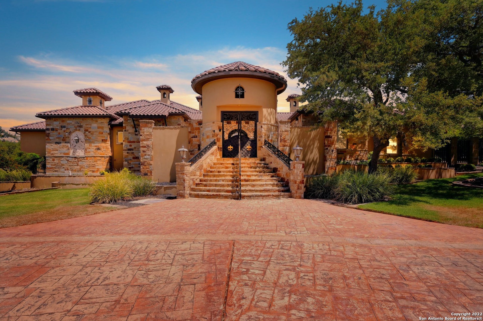 Over 9200 sqft of immaculate Hill Country real estate sitting on 2+ acres in New Braunfels, TX. Entering through a Mediterranean-style courtyard, passing a beautiful fountain, you will be amazed by this homes grand entrance. This custom built home includes beautiful marble mosaics, mesquite wood flooring, high ceilings, cathedral ceilings, custom wood accents, Nanawalls, and Venetian plaster throughout. There are 3 bedrooms on the main floor and a Jack and Jill upstairs, 4 bathrooms, 3 half baths, a spa like owners suite, chef's kitchen, custom designed wine room, theatre with Italian leather seating, a custom bar upstairs with its own built in fridge and ice maker, multiple offices, a safe room, library, a craft room, and a air conditioned oversized 4 car garage. This open floor plan, once you are inside, it will be hard, not to marvel at the beautifully thought-out custom details put in to every room. After arriving home you can escape to your very own personal backyard oasis. With an oversized covered patio, outdoor kitchen, grill, putting green, fire pit, heated pool, hot tub, and gorgeous waterfall, there is something for everyone to enjoy. The casita was designed with the same attention to detail as the main home, with a full kitchen, living area, laundry room, 2 bedrooms, a shared full bath, and attached 3 car garage.