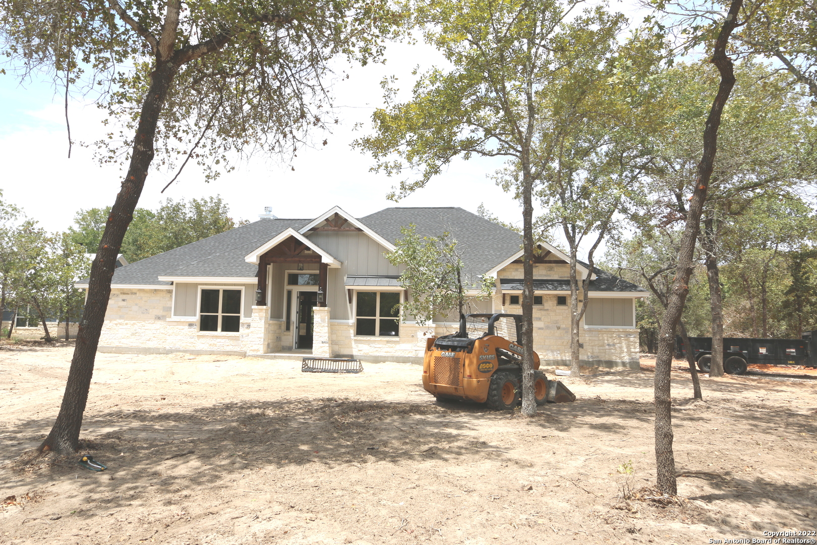 Under Construction in Woodvalley Acres Subd In Adkins Tx..that has NO City Taxes or Mandatory Hoa Dues & A Low 1.9% Tax Rate,Fiber Optics Internet is Available Thru GVEC,La Vernia ISD..Local Custom Home Builder that lives in the Same Subd & has built many homes in the area.. Nearly 2600sf Ranch Style 4-Side Rock Hm w/Lots of Upgrades on 1.55 ACRES w/Trees Galore..*Very Open & Bright Floorplan* w/Lots of Low E Dbl Paine Windows & Upper Transom Windows for Natural Lighting,4-BD's & 2.5 Bathrooms PLUS a Study OR Formal Dining Rm,Approx 17x15 Kit w/ Island & B'fast Bar w/Farmers Sink,Tiled Backsplash,Custom cabinets w/Under Cabinet lighting,Pot-Filler above Cooktop,SS Appliances & Walk in pantry,12x10 Dining Rm AND a 13x11 Formal Dining Rm OR Study w/Raised Beam Ceiling,22x20 Living Rm has Floor to Ceiling Rocked Fireplace & Raised Decorative Beamed Ceiling *Ceramic tile flooring & Granite Countertops Thru-Out* 8' tall doors,Lots of Crown molding,Grand Foyer Via the 10x7 Covered Porch,Split BD Plan w/20X18 Main Bd & 16x15 Main Bathroom that has 2-Sinks,Island Slipper Tub,Walk Thru Shower w/2-Heads & 2-Lg Walk in closets & Outside Access to the Approx 30x16 covered backyard patio w/beaded board ceiling..HM Has Radiant Barrier Roof Decking,Roof Ridge Vent,Exterior flood & soffitt lighting AND Will Have a Partial Landscape Pkg to include Sod,Plants & Sprinkler Sys..Again Local Home Builder,10-YR Warranty  **Call 4 Copy of Floorplan,Tax info,Restrictions,Survey ETC**  "COUNTRY LIVING"