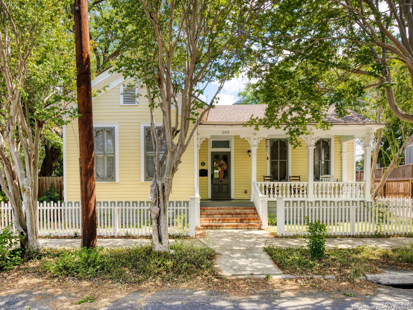 This charming Lavaca home is restored to original perfection including long leaf pine floors, bead board walls, and high ceilings. Enter off the entry hall into the spacious living room with a fireplace and built-ins. The open kitchen/dining has huge windows and abundant light, modern stainless steel appliances, granite counters, and space for an island. A beautiful hand-painted mural of the Tower of The Americas in the second bedroom, an electric car hook-up, a rainwater catchment system, a front porch and back deck with built-in seating, and a view of the Tower are just a few of the extras. Come see this inviting and comfortable home and enjoy all that Southtown has to offer.