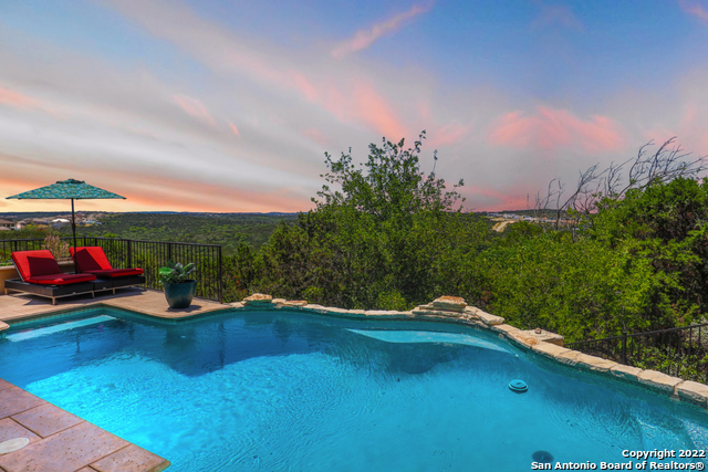 Looking for million dollar views? Fall in love with this beautiful home on the top of the hill in one of San Antonio's most desired neighborhoods, Crownridge.  It is located on a private culdesac lot with 1.75 acres and encompasses protected views of the nature preserve.  The gorgeous stucco exterior welcomes you into the foyer open to the dining and living room where the amazing views begin with windows that span across the entire wall. Upgrades include a new roof in 2019,  electric hunter douglas blinds, and programmable thermostats. This home has tons of storage throughout from a walk-in pantry to the large attic space on the second floor and an overly spacious primary bedroom and closet. The kitchen has quartz countertops, dual convection ovens, a built in wine fridge, and a huge custom island for prep work and serving. The backyard is just as great, if not, better!  Whether you're enjoying the views from your Texas shaped pool, or catching sunsets on the covered patio, this is a piece of paradise. Take a stroll down the hill on this vast property or bird watch for the rare purple martins, you'll never want to leave!  This home could be yours then you won't have to!!    https://www.klapty.com/tour/CNb0tlmwqI