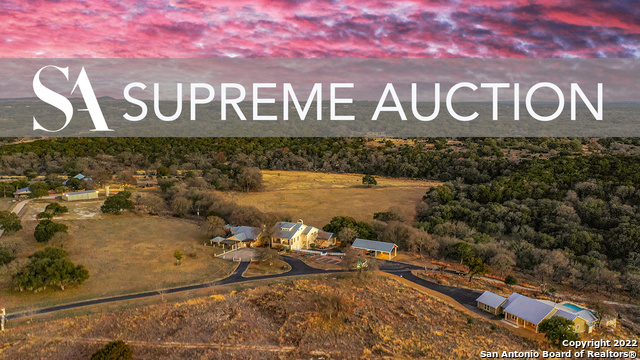AUCTION - AUG 30 - SEPT 1. The CW Ranch is an incomparable Retreat in the heart of Texas Hill Country! Nestled among 66+ acres with century-old Oak trees, wildflowers, and a spring-fed seasonal creek. The property encompasses the main lodge, a secondary home, event venue, guest house, guest cottage, equipment barn with workshop, and irrigated fields, with ideal conditions for a vineyard. The property was designed as a wedding event venue and ranch retreat. With multiple homes & buildings, the ranch affords you the opportunity to create your very own personal haven, equestrian facility, hunting lodge, family compound, entertainment event destination, or maintain its current use as a ranch retreat and wedding destination, the possibilities are endless. A Rare Opportunity to own at YOUR price! be sure and see Virtual Tour